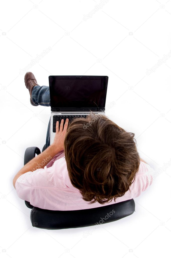 High angle view of man working on laptop