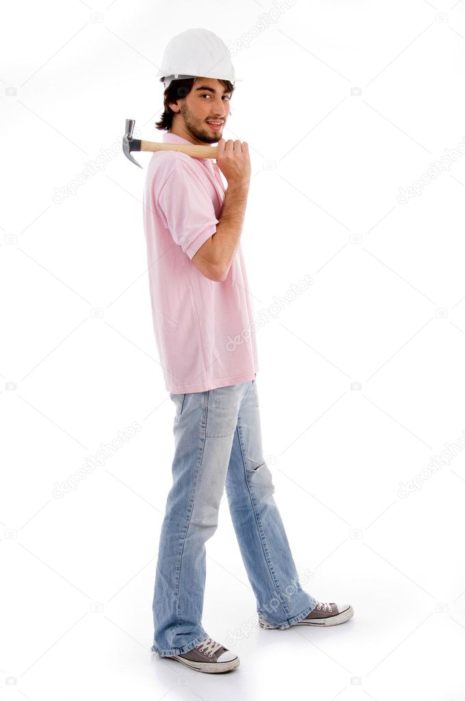 Architect with hammer posing