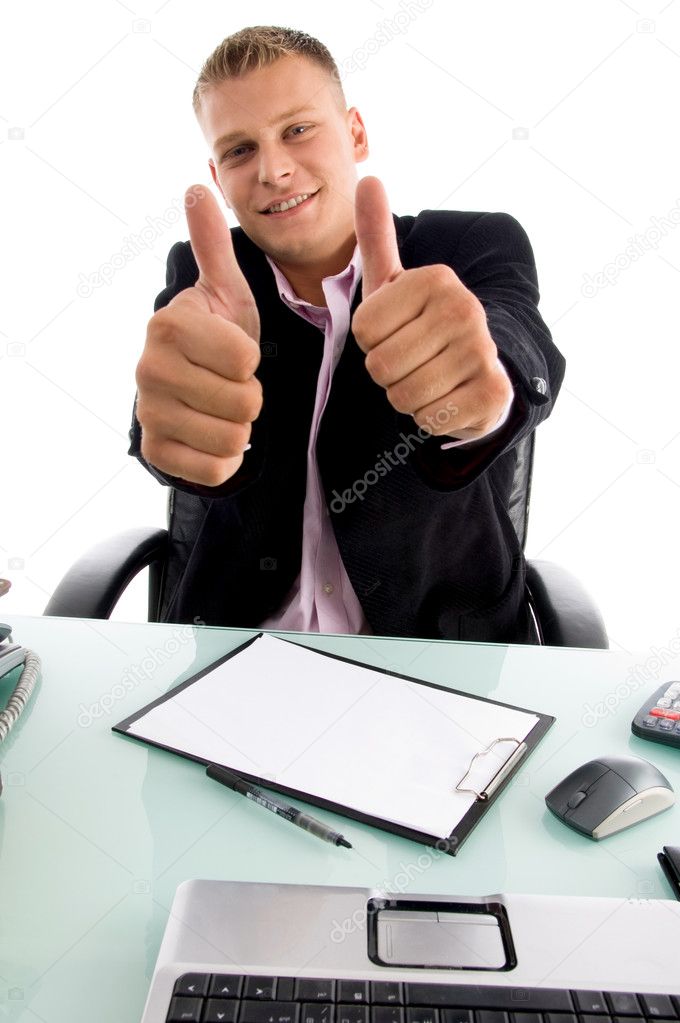 Smiling boss showing thumbs up