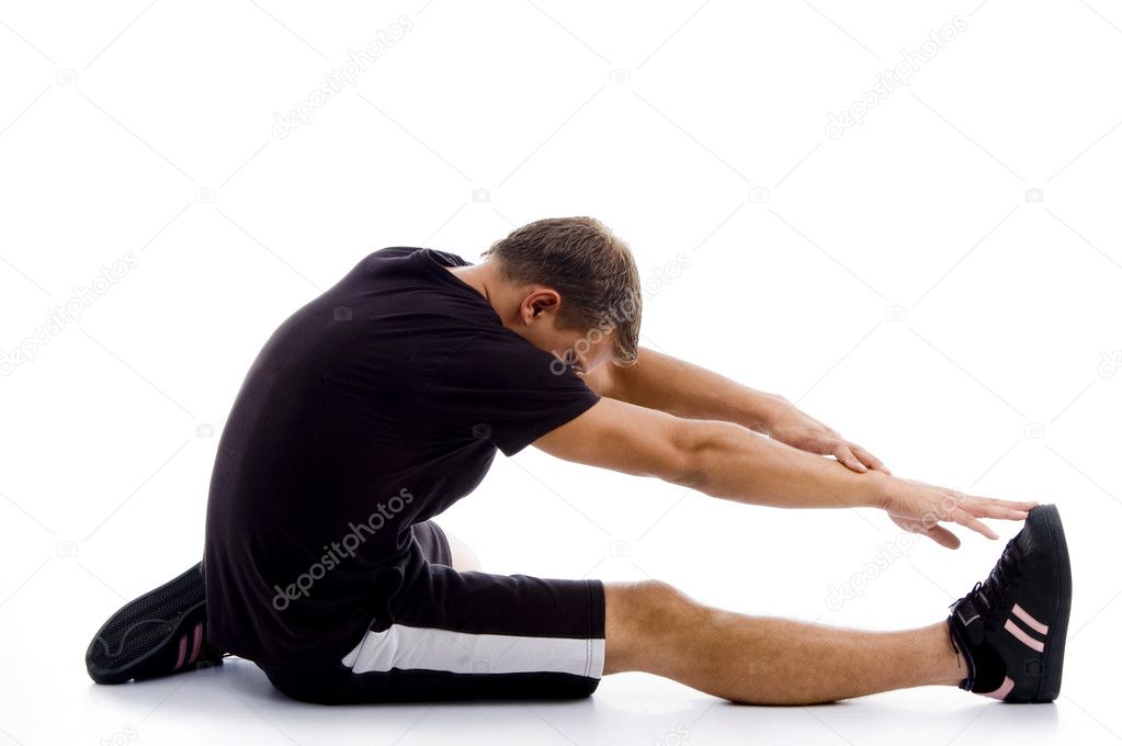 Muscular guy stretching himself