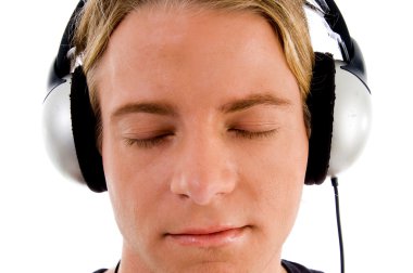 Handsome male tuned into music clipart