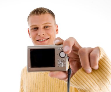 Handsome man showing digital camera clipart