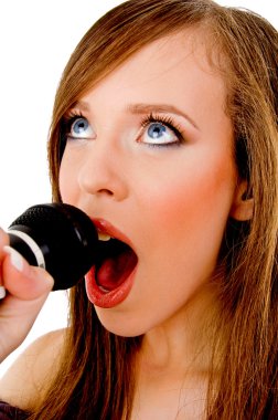 Woman singing into karaoke clipart