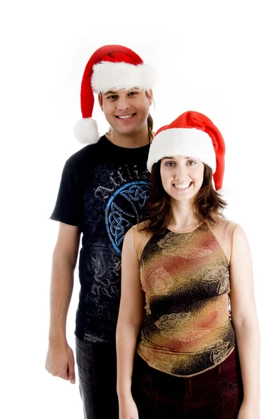 年轻夫妇戴着圣诞帽 — 图库照片