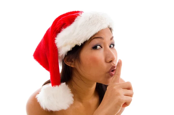 Woman with christmas gesturing silence — Stock Photo, Image