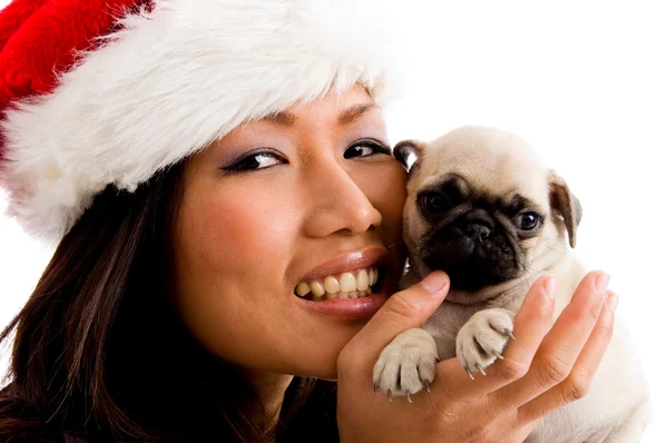 Smiling woman playing with puppy — Stock Photo, Image
