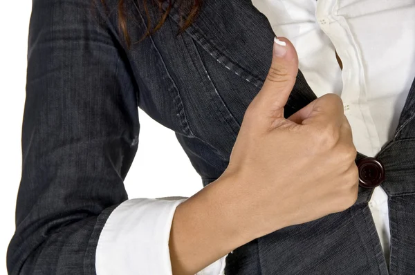 Female showing thumbs up close to body — Stock Photo, Image