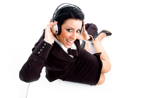 Businesswoman wearing headphones — Stock Photo, Image