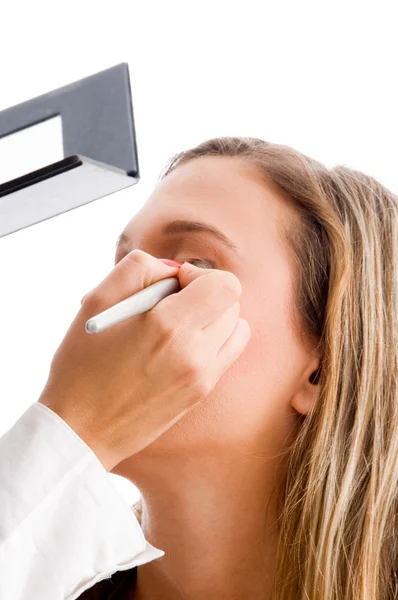 Beautiful woman getting eye makeup — Stock Photo, Image
