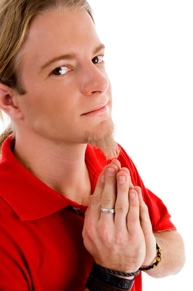 Male looking at camera while praying — Stock Photo, Image