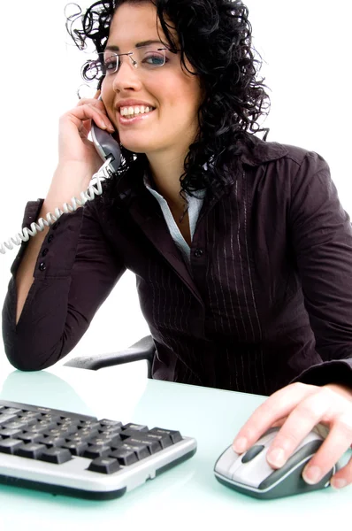 Young female attending call — Stock Photo, Image