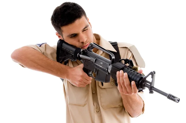 stock image Young soldier pointing with gun