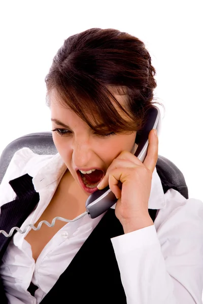 Angry young businesswoman on call — Stock Photo, Image