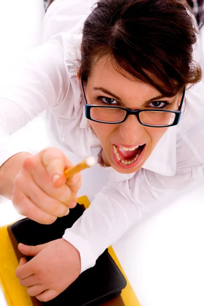 Shouting female pointing with pencil — Stock Photo, Image