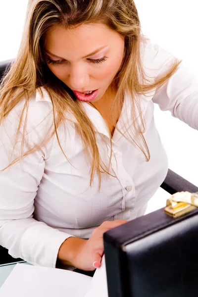 Surprised businesswoman looking at file — Stock Photo, Image