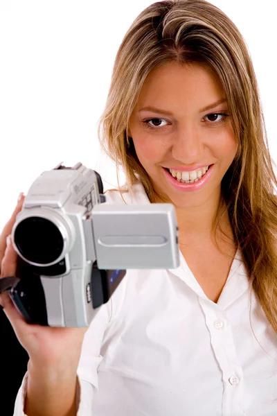 Lachende vrouw opnemen via camera — Stockfoto