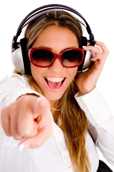 Pointing female enjoying music — Stock Photo, Image