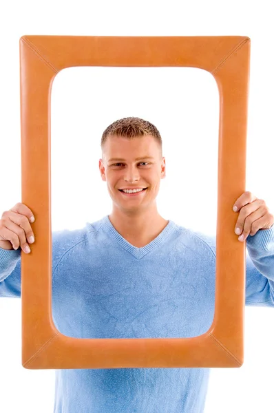 Adult man looking through frame — Stock Photo, Image