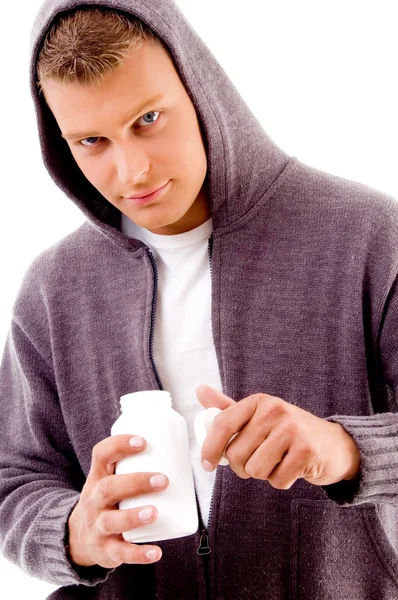 薬の瓶を保持している若い男性 — ストック写真