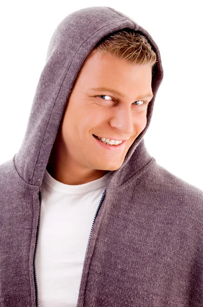 Smiling man with hood coat — Stockfoto