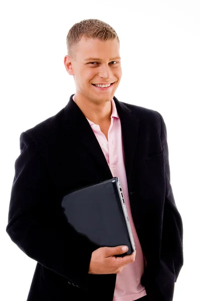 Pleased businessman holding laptop — Stock Photo, Image