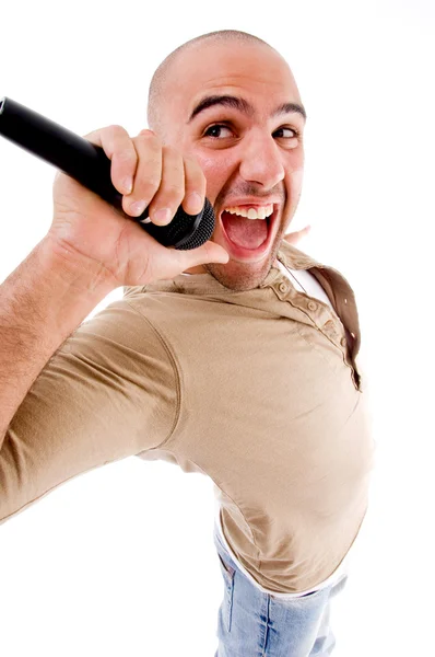 Happy singer singing into microphone — Stock Photo, Image