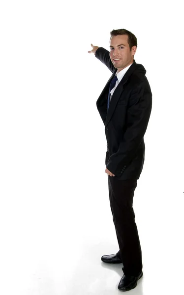 Smart businessman pointing sideways — Stock Photo, Image