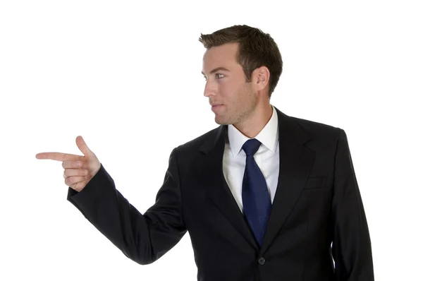 Businessman pointing sideways — Stock Photo, Image