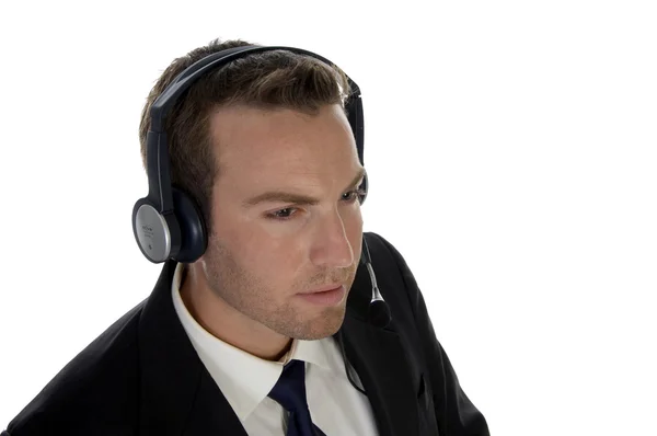 Homem de negócios usando fone de ouvido — Fotografia de Stock