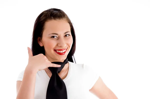 Woman making call gesture and smiling — Stock Photo, Image