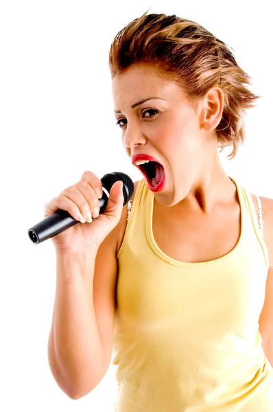 Sexy female singing in microphone — Stock Photo, Image