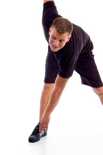 Przystojny mięśni mężczyzna robi ćwiczenia — Zdjęcie stockowe