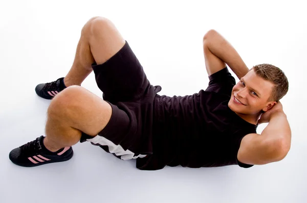 Muscular man doing crunches — Stock Photo, Image