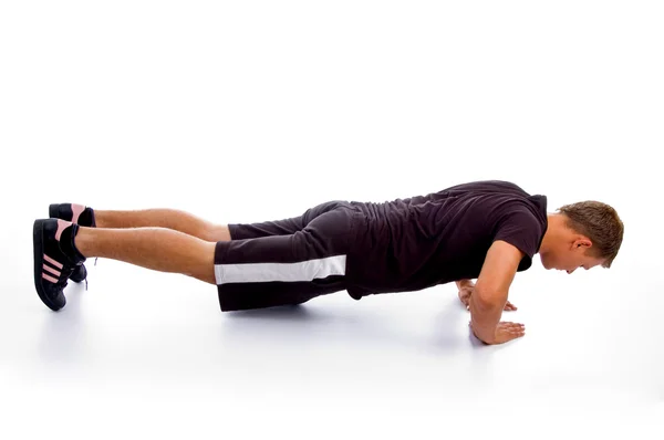 Jongeman doet push-ups — Stockfoto