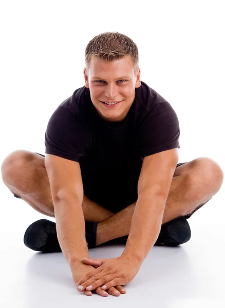 Мускулистый мужчина, лежащий на полу — стоковое фото