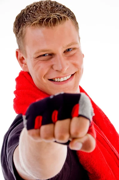 Smiling muscular male showing punch — Stock Photo, Image