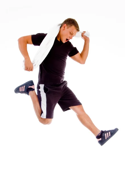 Giovane uomo che salta a mezz'aria — Foto Stock