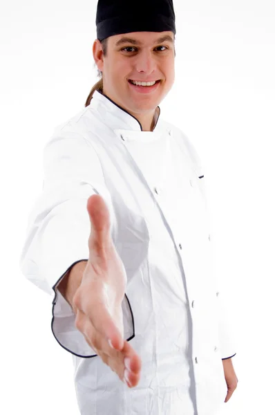 Jovem chef oferecendo aperto de mão — Fotografia de Stock