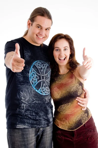 Young couple showing thumbs up — Stock Photo, Image