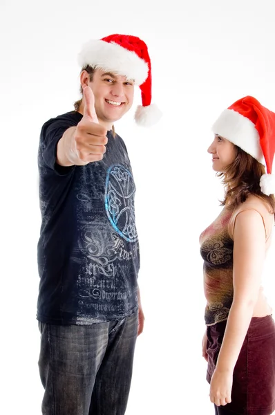 Vánoční pár při pohledu na fotoaparát — Stock fotografie