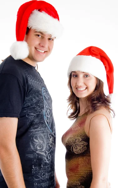 Рождественская пара смотрит в камеру — стоковое фото