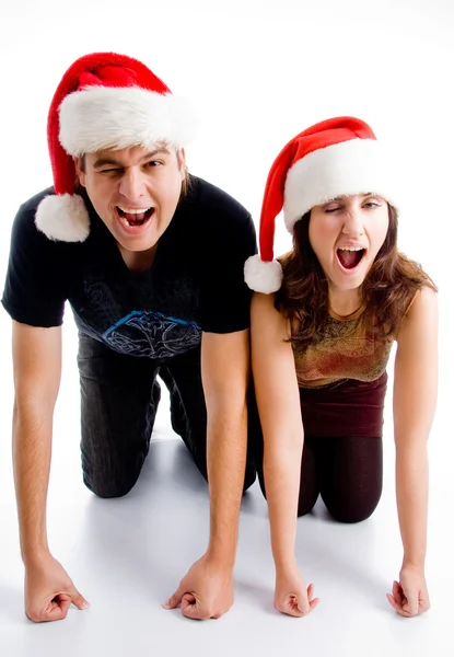 Christmas couple winking at camera — Stock Photo, Image