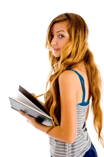 Student with books looking at camera — Stock Photo, Image