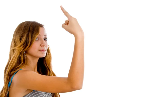 Mulher jovem indicando com o dedo — Fotografia de Stock