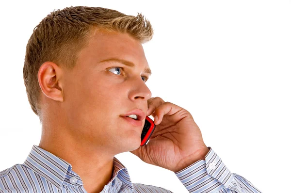 Pohledný muž mluví do mobilního telefonu — Stock fotografie
