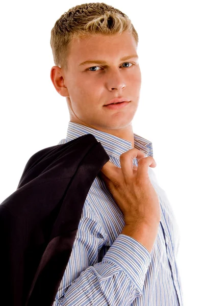 Young man holding his coat — Stock Photo, Image