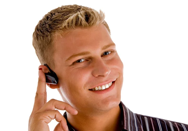 Young businessman wearing blue-tooth — Stock Photo, Image