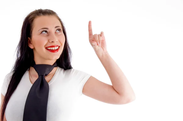 Young woman pointing upwards — Stock Photo, Image