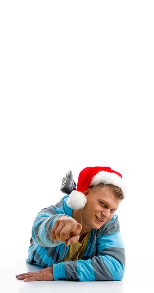 Genç adam Noel şapka ile işaret — Stok fotoğraf