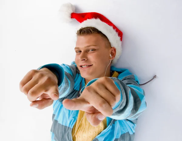 Pointing man with christmas hat — Stock Photo, Image
